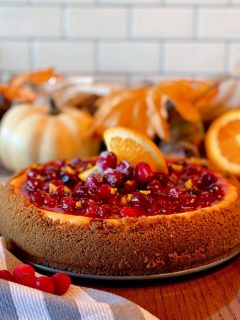 Cranberry Orange Cheesecake with Fall background