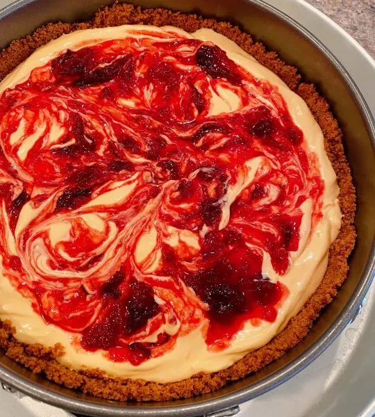 Cranberry filling swirled into cheesecake batter