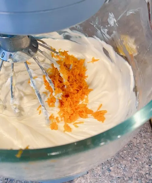 Adding the zest of one orange to cream cheese mixture