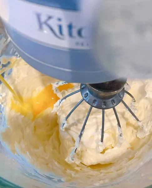 Cream Cheese, eggs, and sugar in mixing bowl.