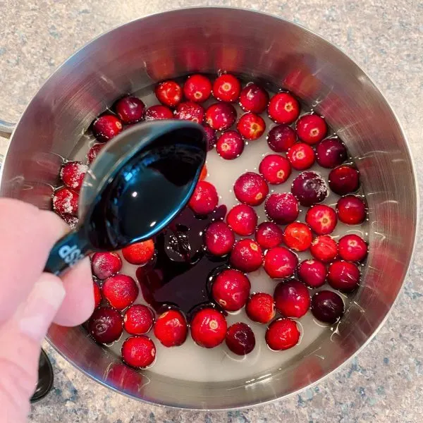 cranberries, sugar, water, and cranberry flavoring in sauce pan