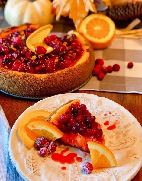 Cranberry Orange Cheesecake sliced on a plate
