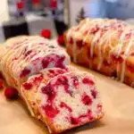 Cranberry Eggnog Bread on a board sliced