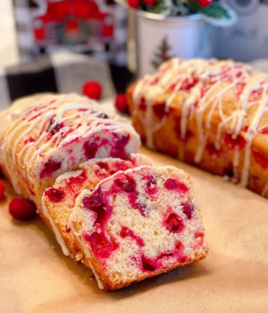 Cranberry Eggnog Bread on a board sliced