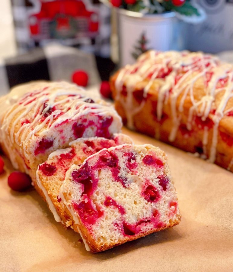 Cranberry Eggnog Bread on a board sliced