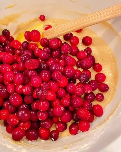 Adding cranberries to bread batter