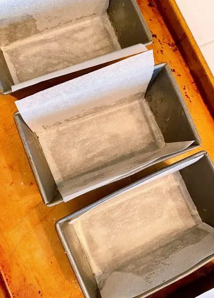 mini loaf pans lined with parchment paper