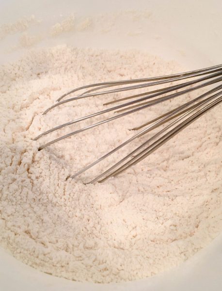 Dry cookie ingredients in a mixing bowl