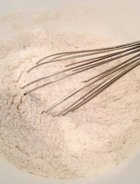 Dry cookie ingredients in a mixing bowl