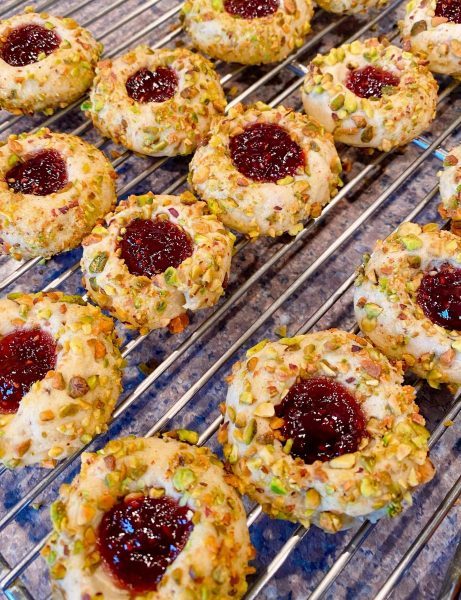 Thumbprint cookies cooling on baking rack