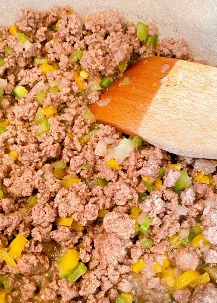 Ground Beef in skillet cooked.