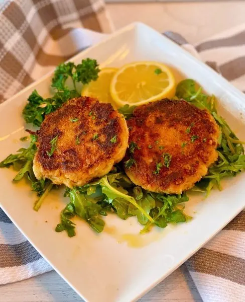 Crab Cakes on a bed of Arugula with a citrus vinaigrette