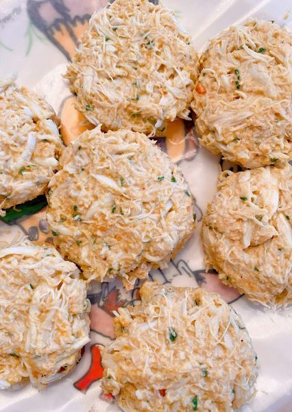 crab mixture shaped into cakes on a plate