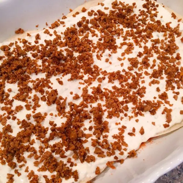 Ground Beef spread over cream mixture.