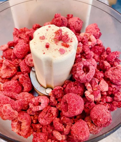 Adding the dried raspberries to food processor.