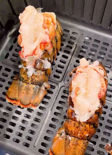 Lobster Tails in the bottom of the air fryer