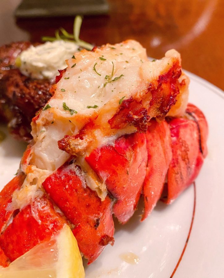 Air Fried Lobster Tail on a China Plate drizzled with lemon butter.