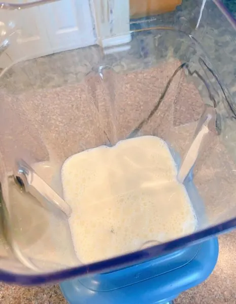 Mixer with milk and whipping cream as base of milk shake.