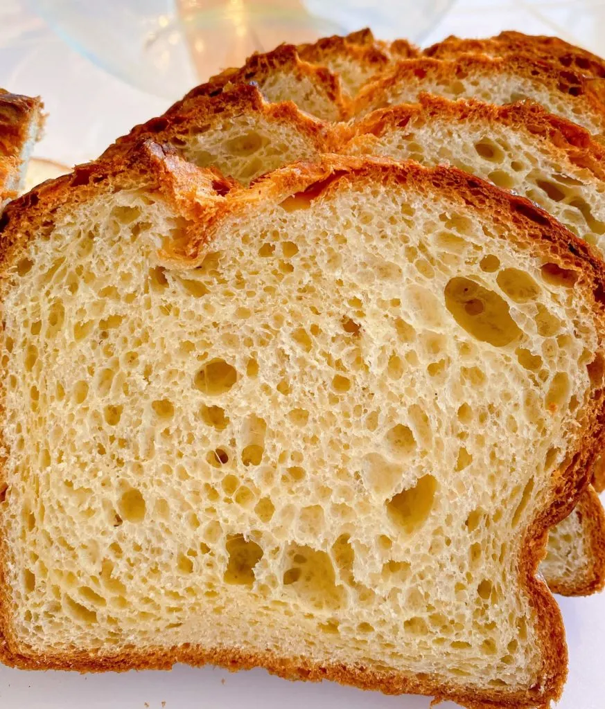 Sliced brioche bread on a cutting board.