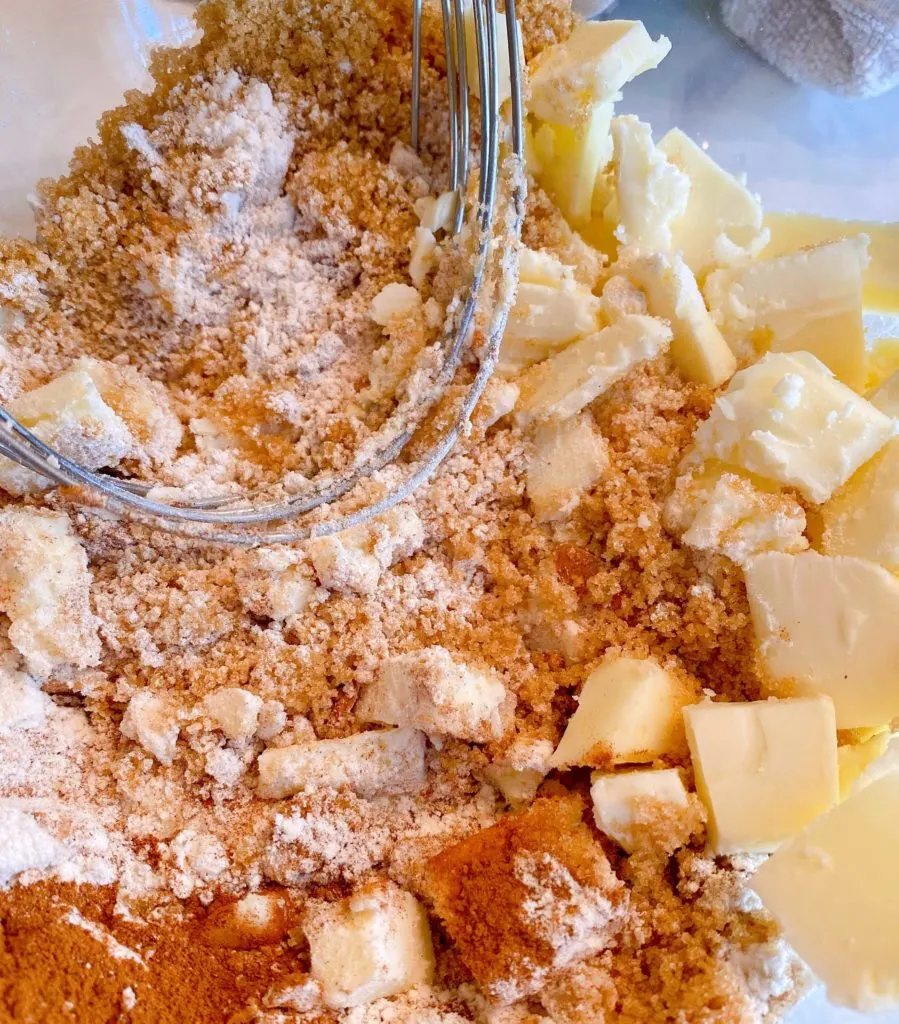 Crumb topping ingredients in a medium bowl with a pastry blender.
