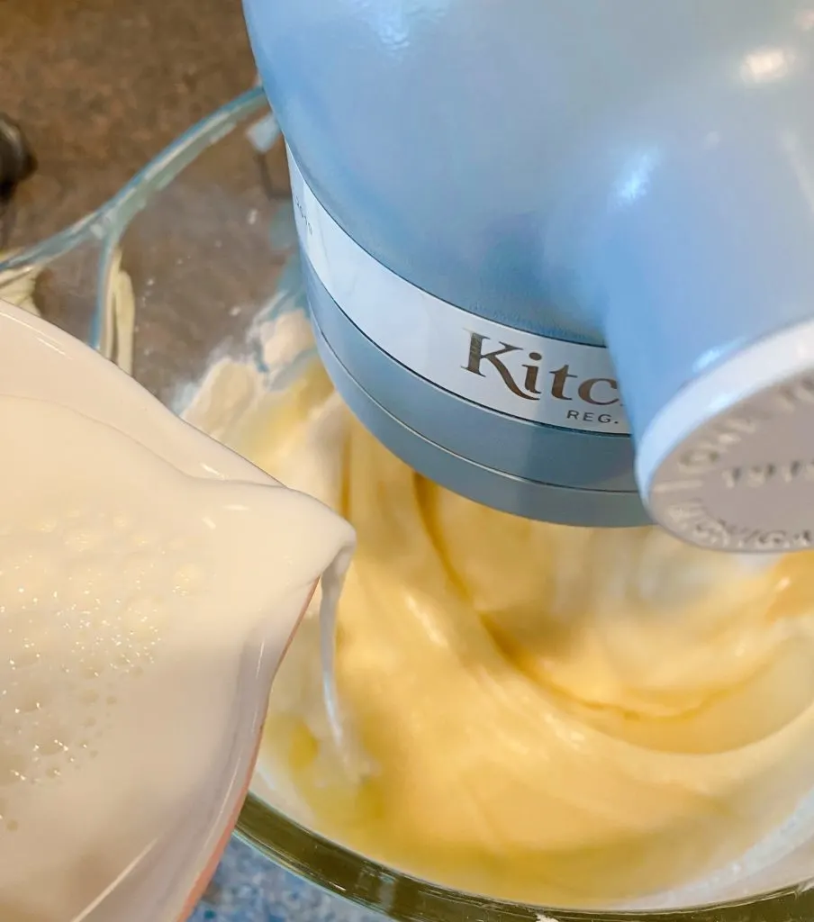 Adding milk and flour to egg batter. 