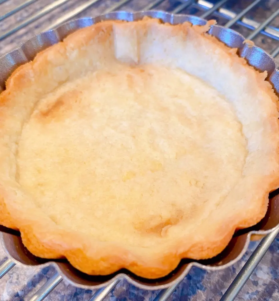 Baked Shortbread crust in a tartlet pan.