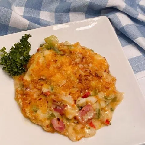 Ham and Broccoli Potato Casserole on a white serving plate.
