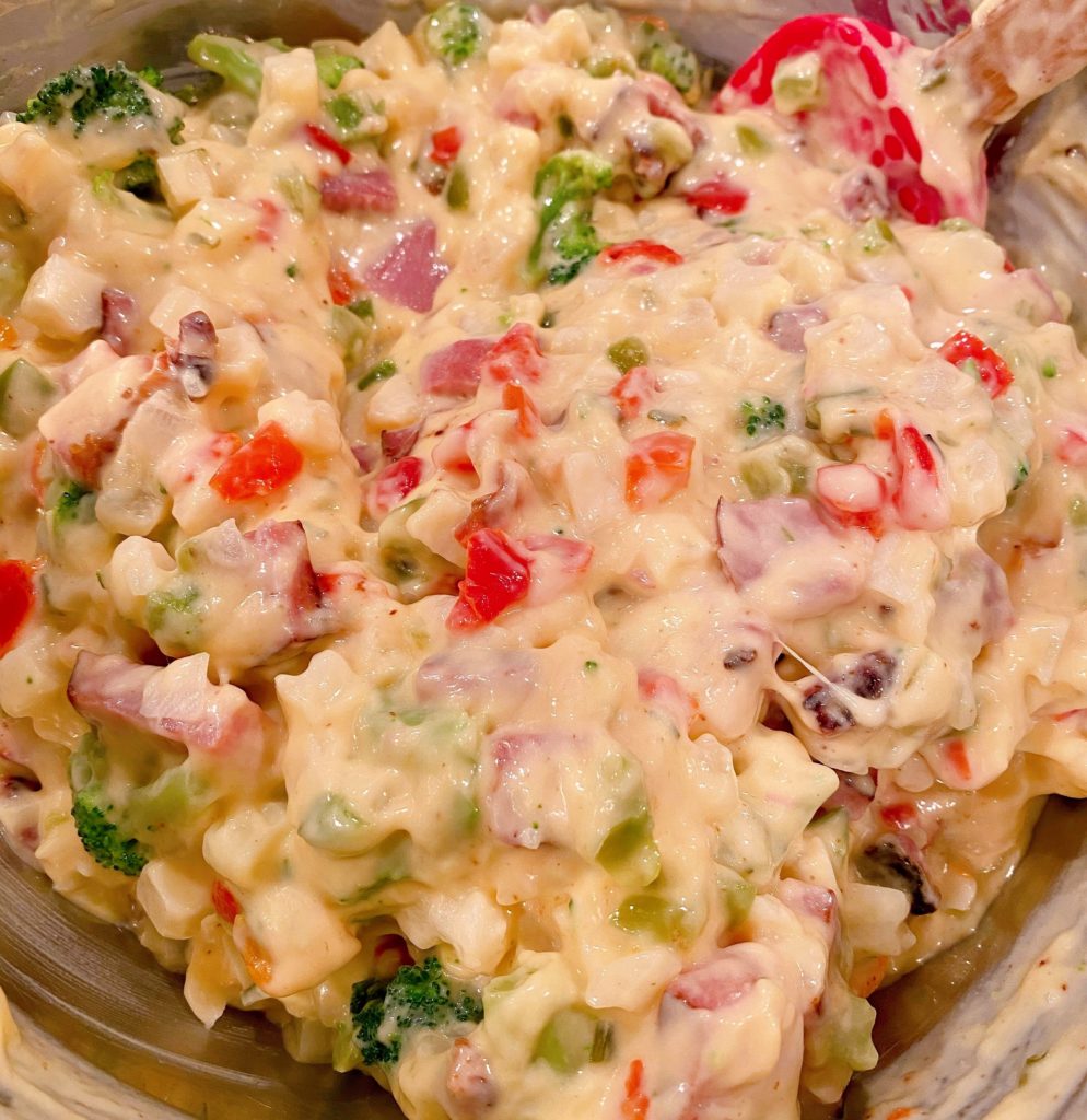 Casserole ingredients mixed together in large mixing bowl.