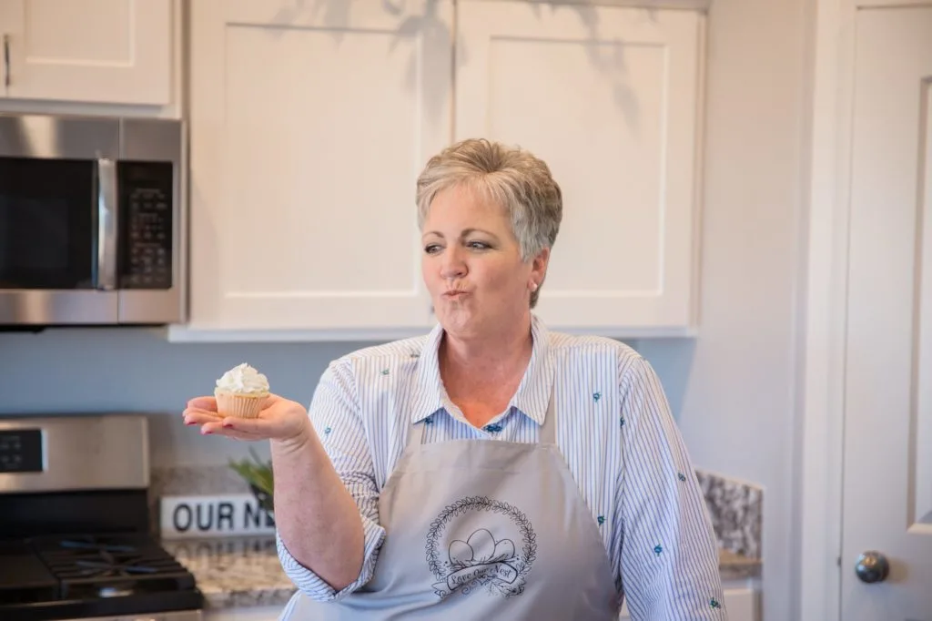 Norine holding a cupcake