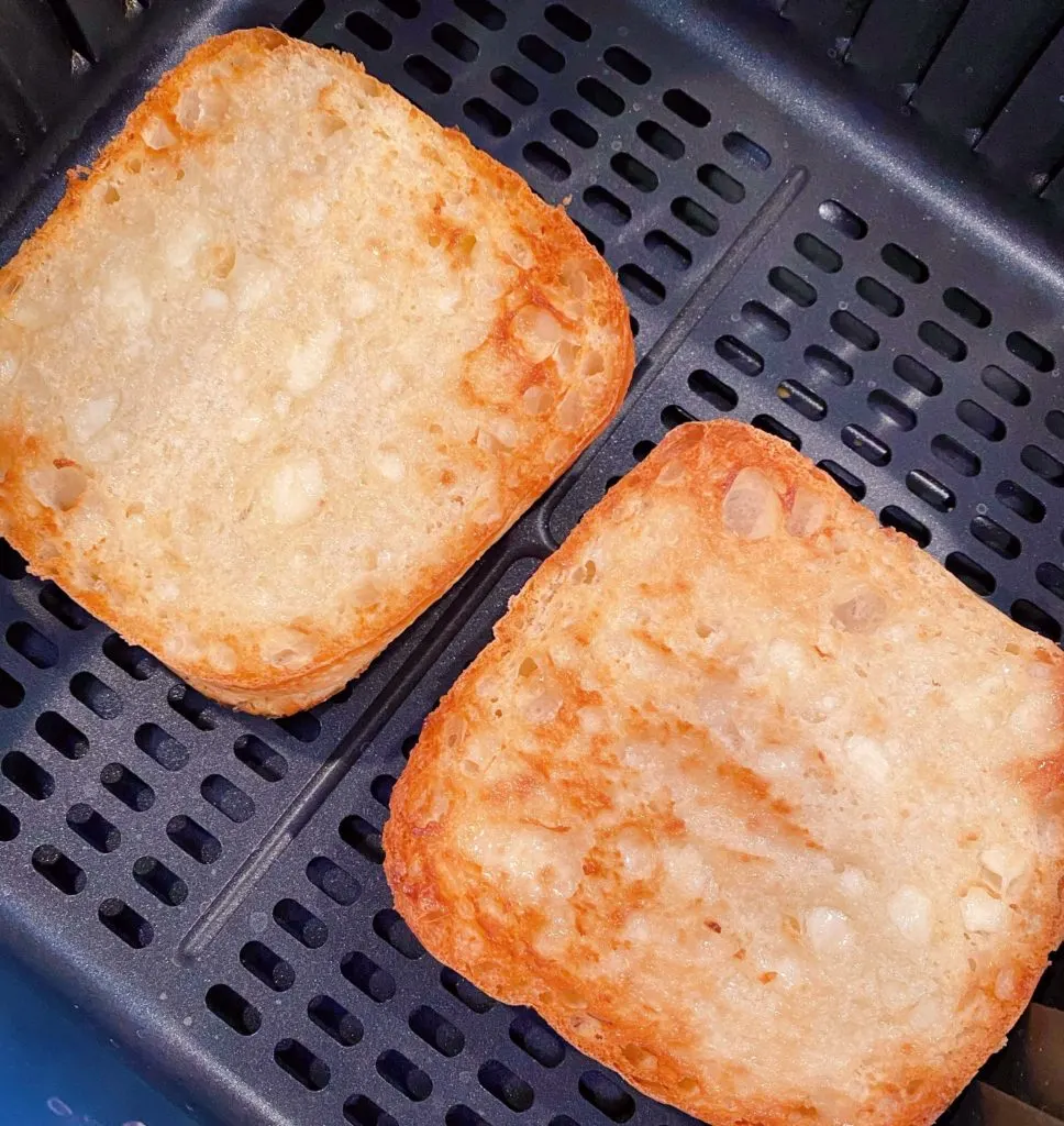 Ciabbata roll toasted to perfection inside the air fryer basket. 