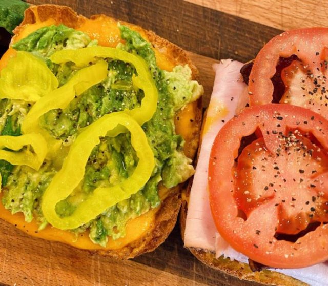 Air Fryer Toasted Turkey Sandwich being made on a cutting board