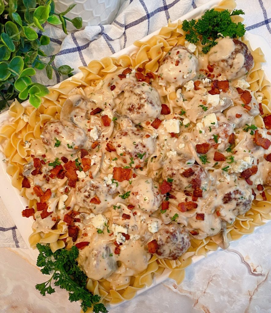 Overhead shot of the creamy bacon and beef meatballs and noodles.