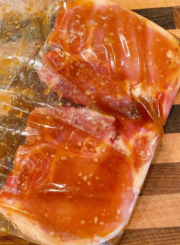 Pork chops in a ziploc bag with marinade