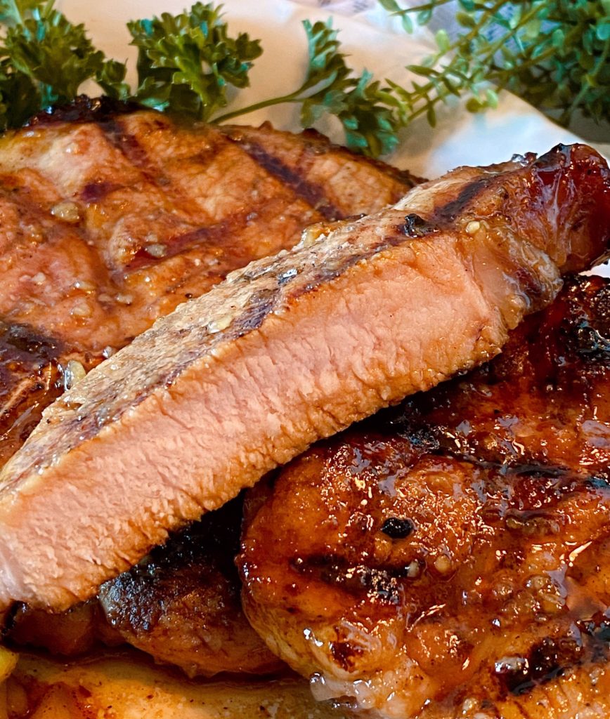 Tender Juicy Pork Chops cut open.