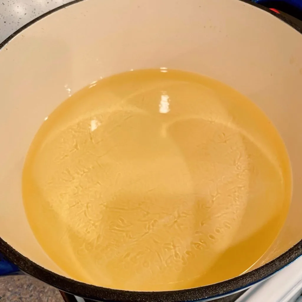 Oil heating in large dutch oven.