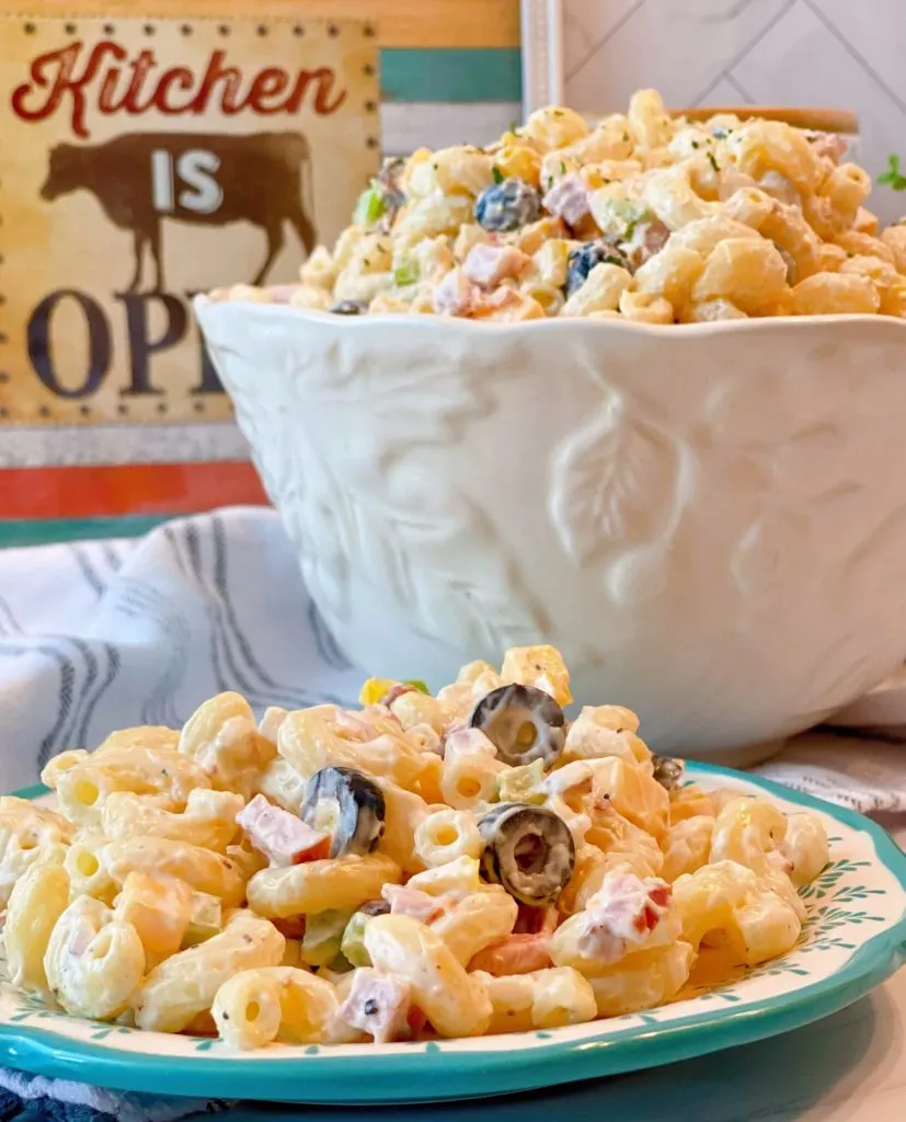 Creamy Summer Macaroni Salad in a large serving bowl and on a salad plate.