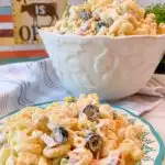 Creamy Summer Pasta Salad in a serving bowl and on a plate.