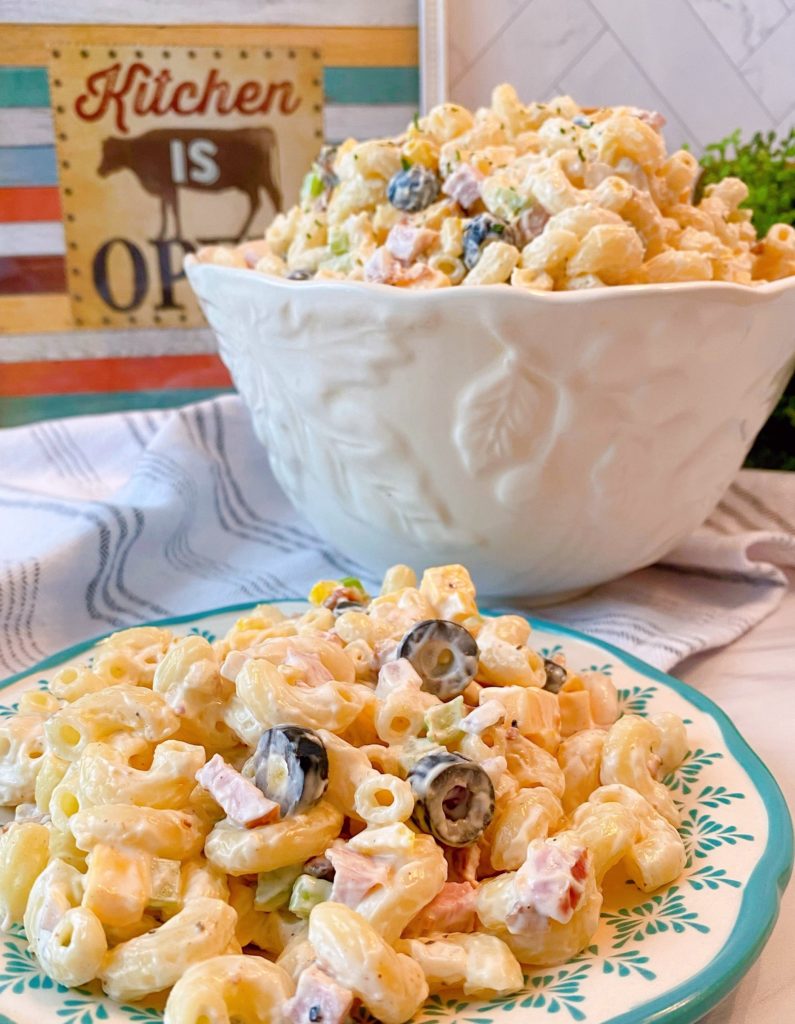 Creamy Summer Pasta Salad in a serving bowl and on a plate.