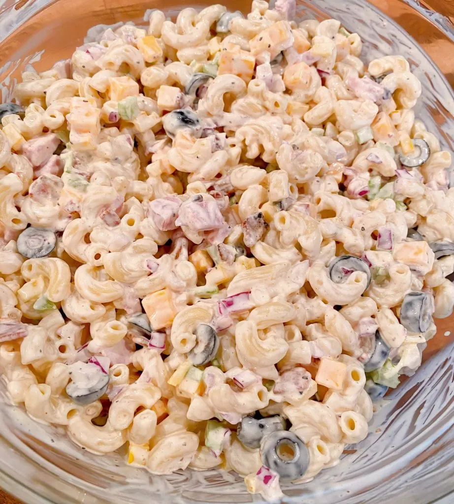 Macaroni Pasta salad mixed in a bowl ready to chill.