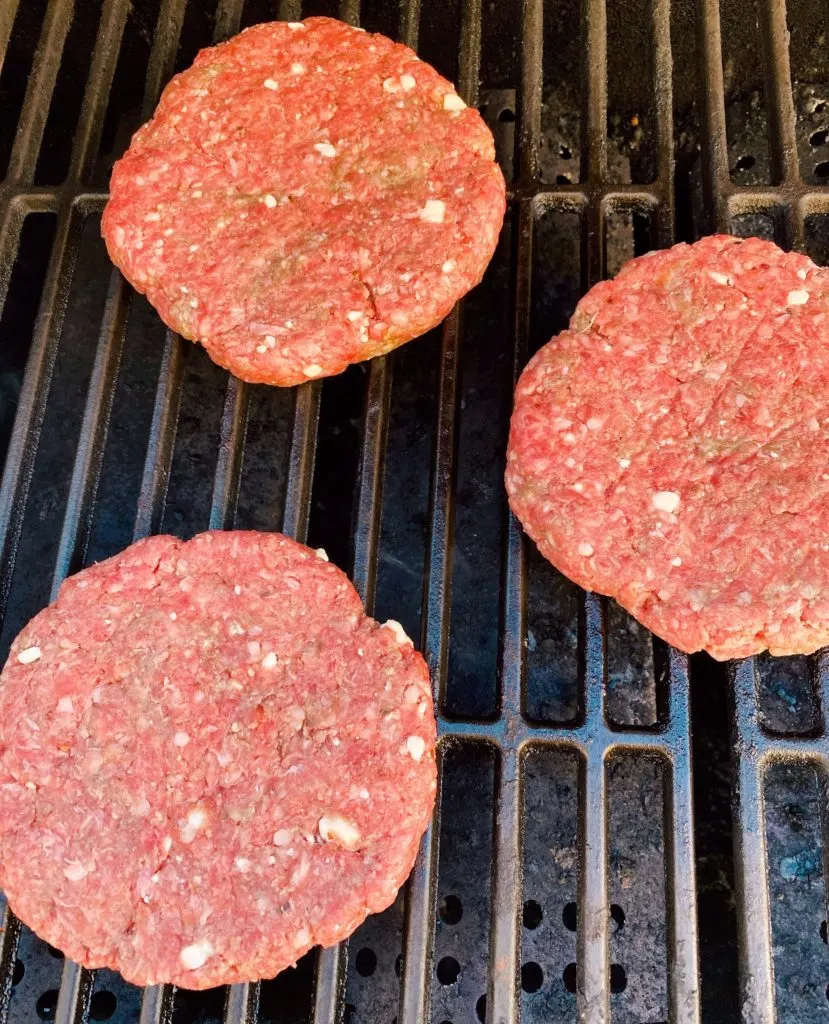 Hamburger patties on BBQ grill.