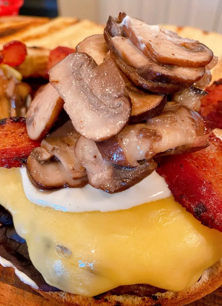 Mushrooms and shallots added to burger.