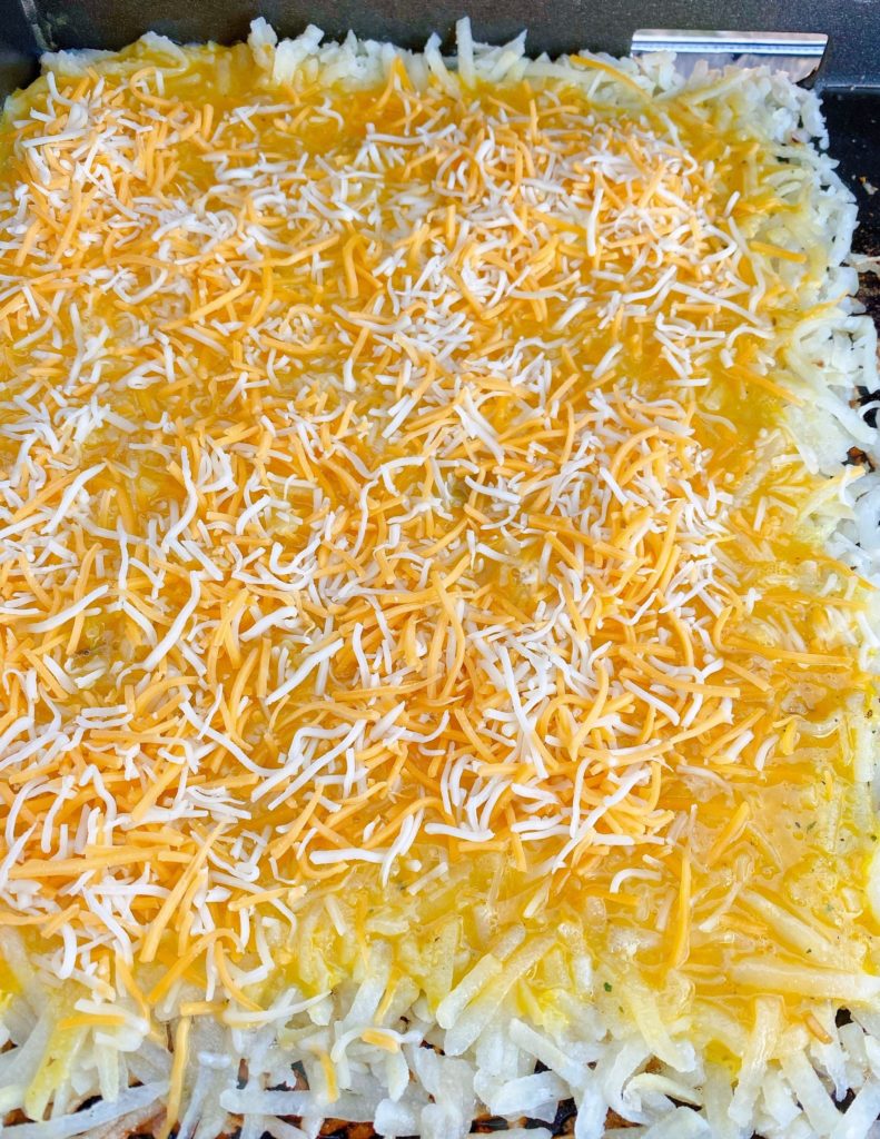 Grated Cheese sprinkled over the top of the eggs.