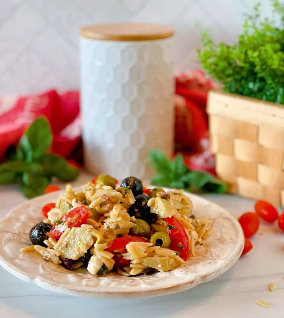 Muffuletta Olive Pasta Salad on aa white plate.