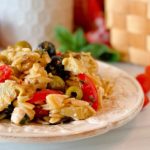 Muffuletta Olive Pasta Salad on a rustic plate.