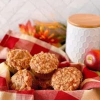 Pumpkin Apple Muffins in a basket on the kitchen counter.