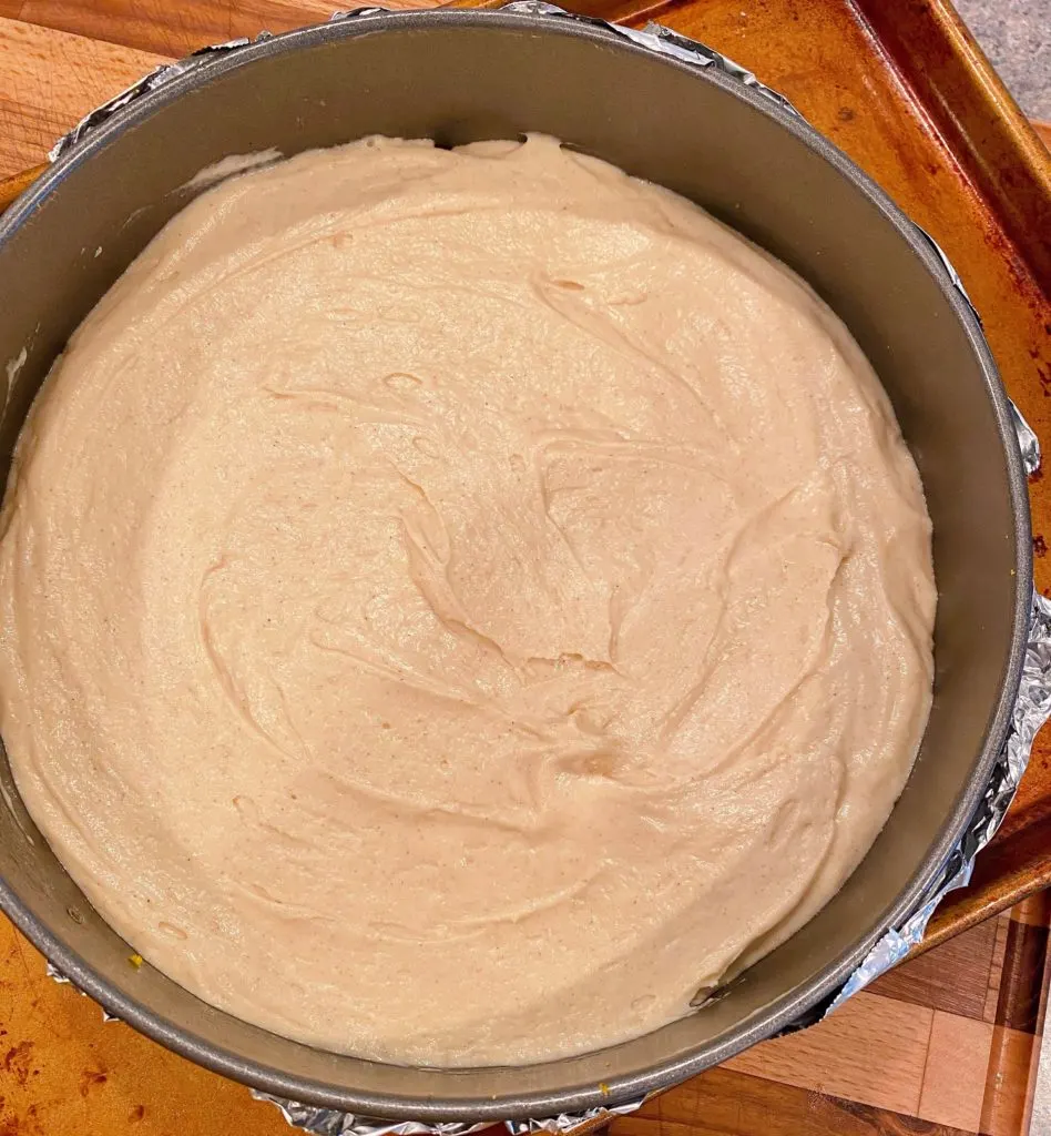 Cake batter over the top of the cranberry topping.