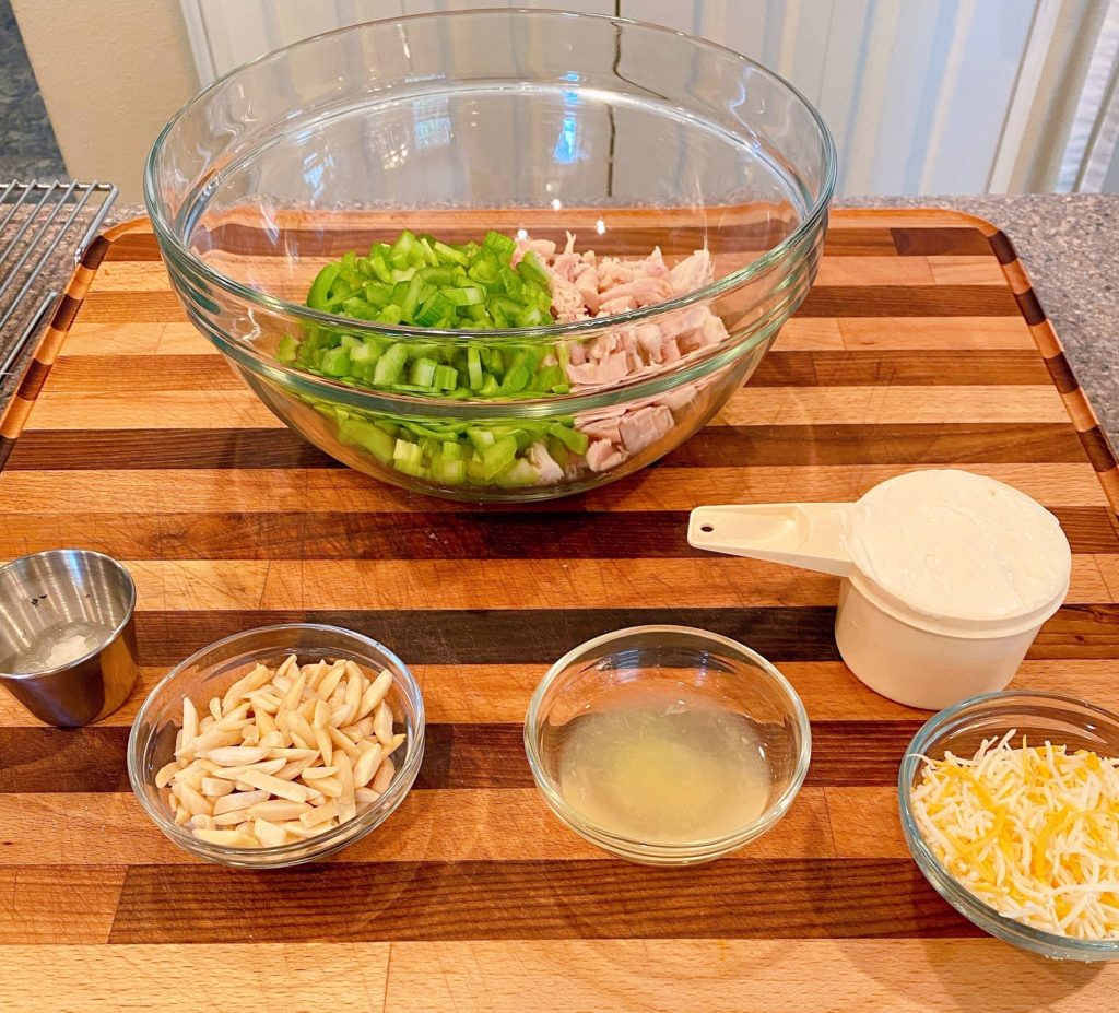 Ingredients prepped and ready to assemble on a wood cutting block.