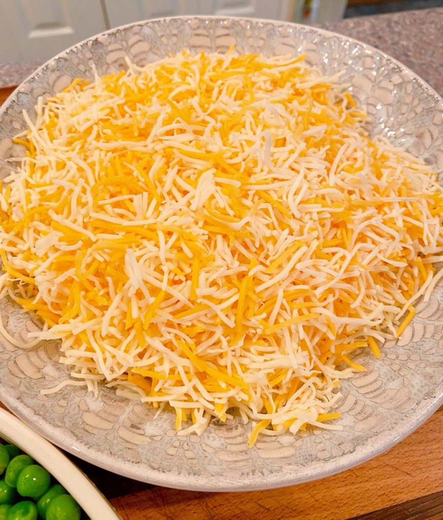 Grated cheese for Haystacks in a bowl.