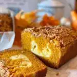 Pumpkin Cream Cheese Streusel Topping sliced on a kitchen counter.