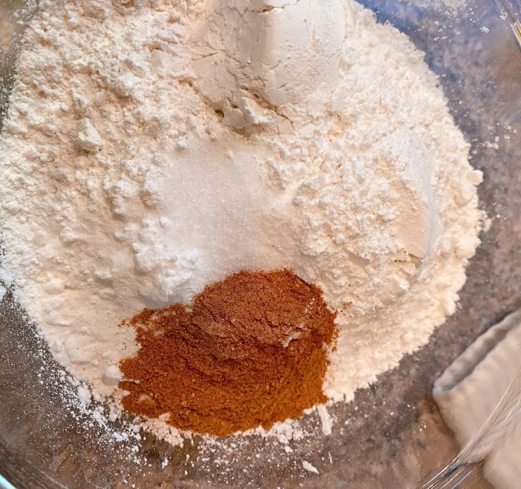 Mixing dry ingredients in a bowl for cake batter.